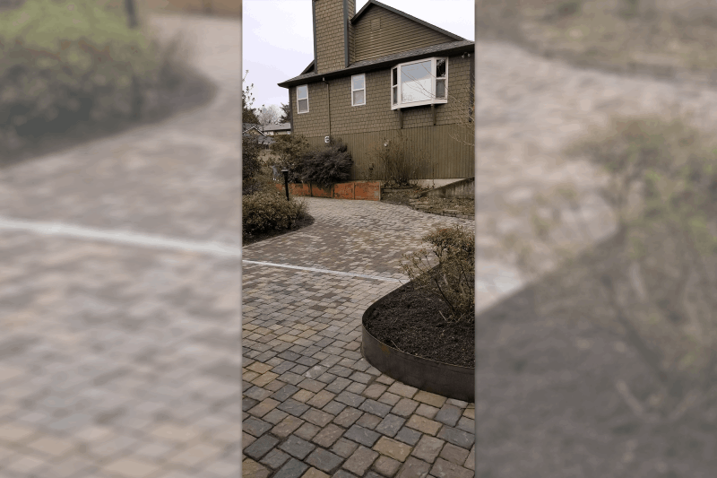 A winding hardscape entrance welcomes you home.