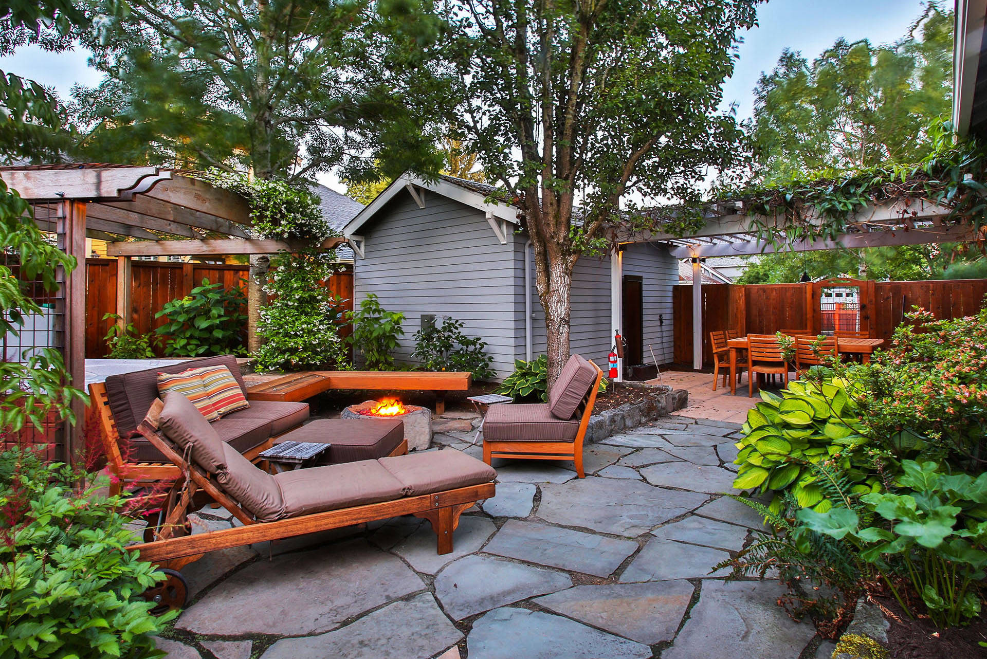 A warming fire structure extends the outdoor enjoyment of this beautiful hardscape.